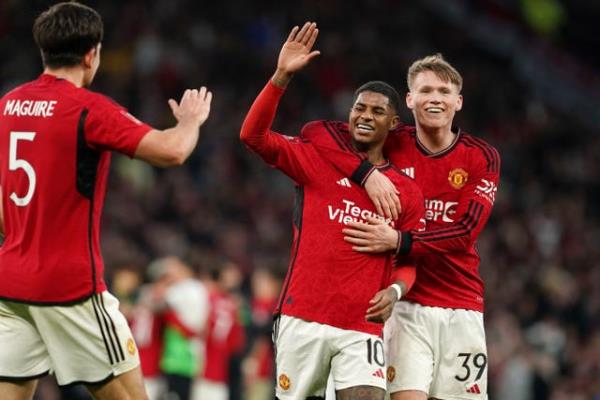 Marcus Rashfor<em></em>d (left), Scott McTominay and Harry Maguire celebrate after the full-time whistle