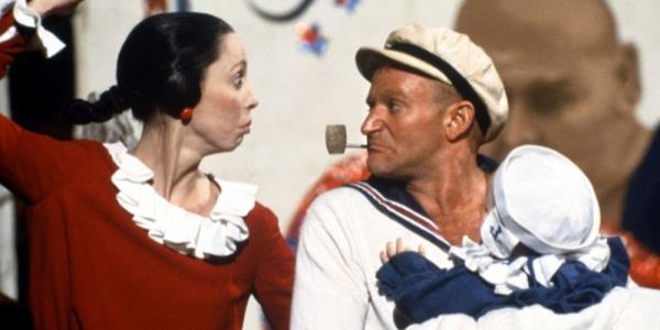 Robin Williams as Popeye and Shelley Duvall as Olive Oyl look at each other in Popeye