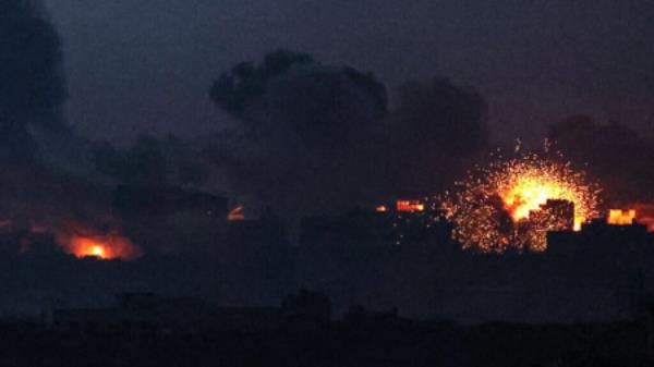 A picture taken from southern Israel near the border with the Gaza Strip on December 2, 2023, shows an explosion and smoke billowing over the coastal territory during an Israeli strike as battles resumed between Israel and Hamas. AFP<em></em>
