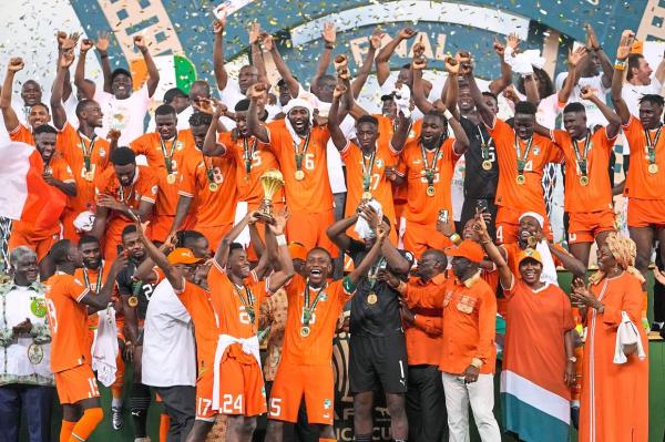 Ivory Coast players celebrate after winning the African Nations Cup. — AP