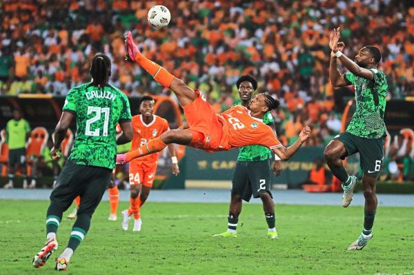 Ivory Coast forward Sebastien Haller makes an attempt at goal during the final. Right: Franck Kessie (centre) scores Ivory Coast’s first goal in the final. — AFP