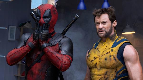 Deadpool is shocked and stands alo<em></em>ngside Wolverine.